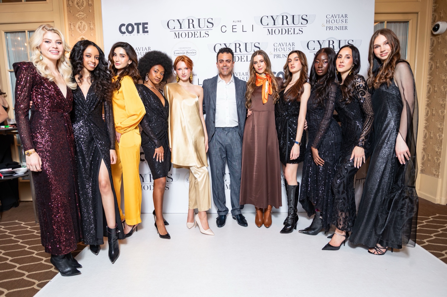 Cyrus Models and the cast of a previous Fashion Night